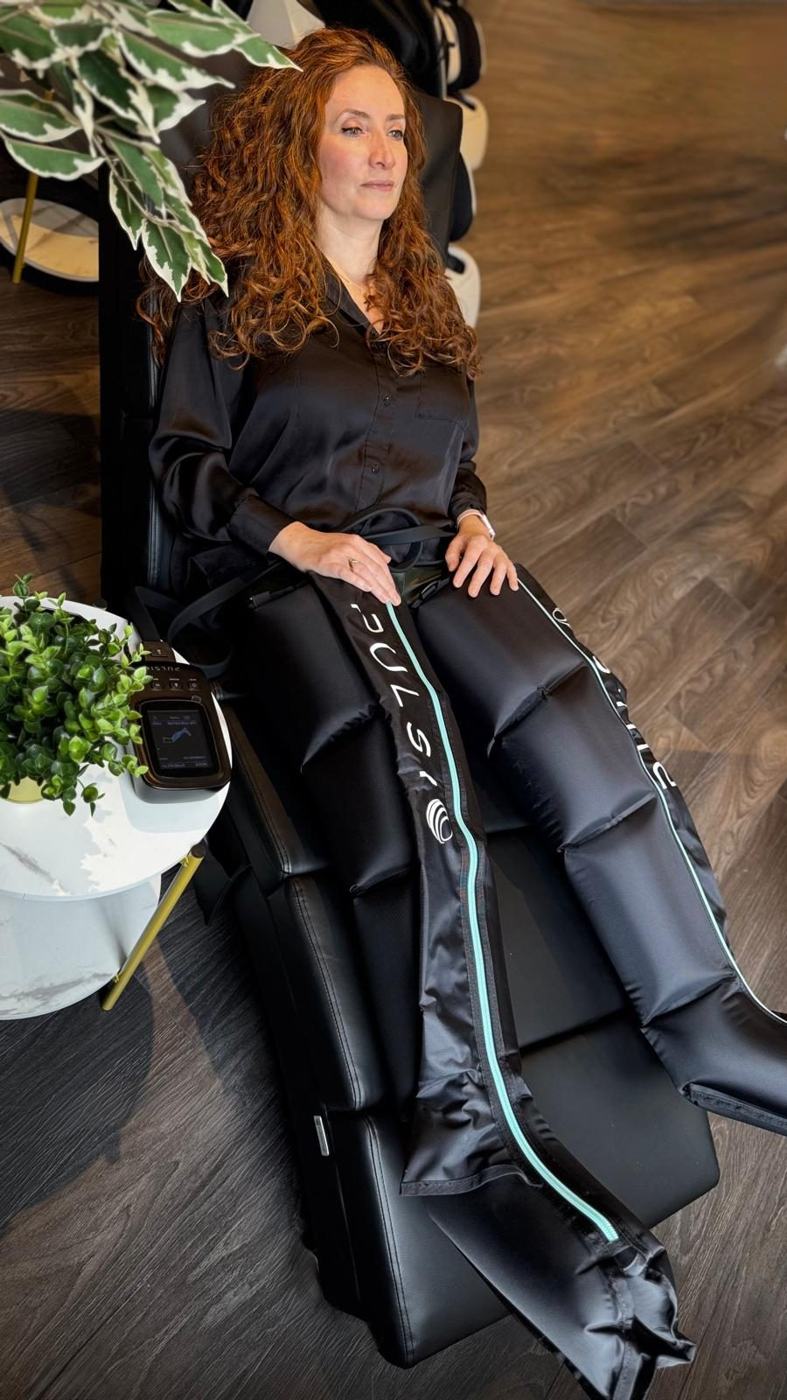 A client relaxing in the compression boots