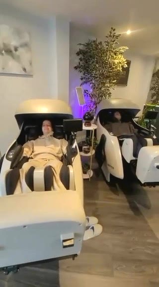 A client in the compression boots, the oxygen chambers behind him